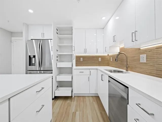 a view of a hallway with a chandelier