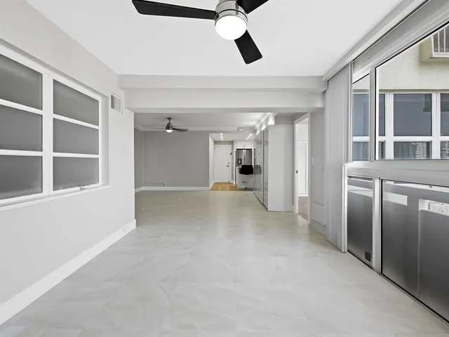 a kitchen that has a sink and a stove in it