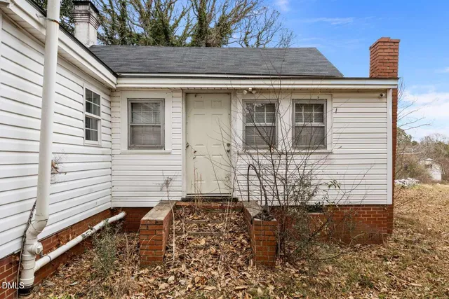 a front view of a house with large windows