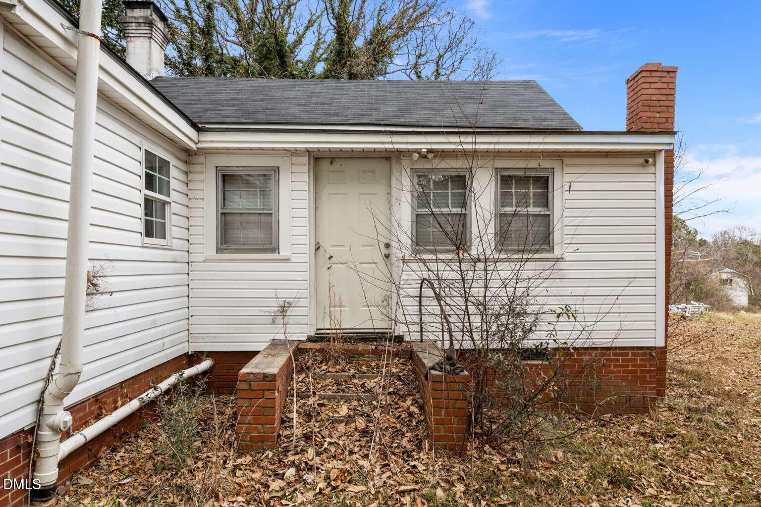 2821 Old Fairground Road Angier, NC 27501 - Photo 28 of 32 a front view of a house with large windows