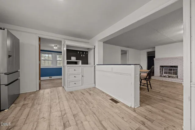 a kitchen with stainless steel appliances a refrigerator and a stove top oven