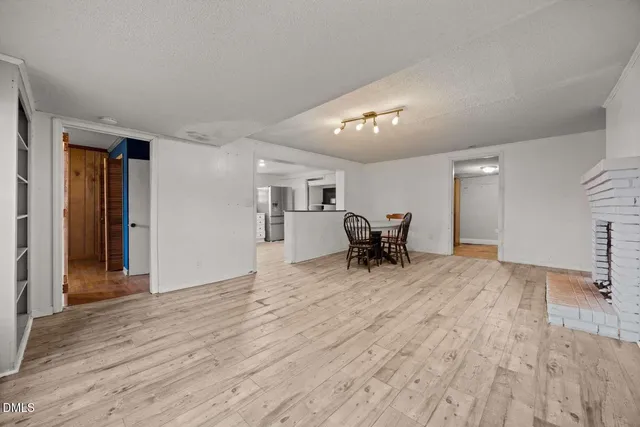 a view of a livingroom with furniture and a flat screen tv