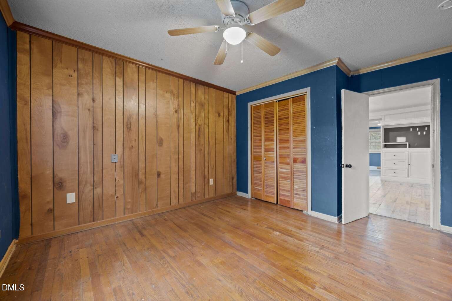 2821 Old Fairground Road Angier, NC 27501 - Photo 8 of 32 wooden floor in an empty room with a window
