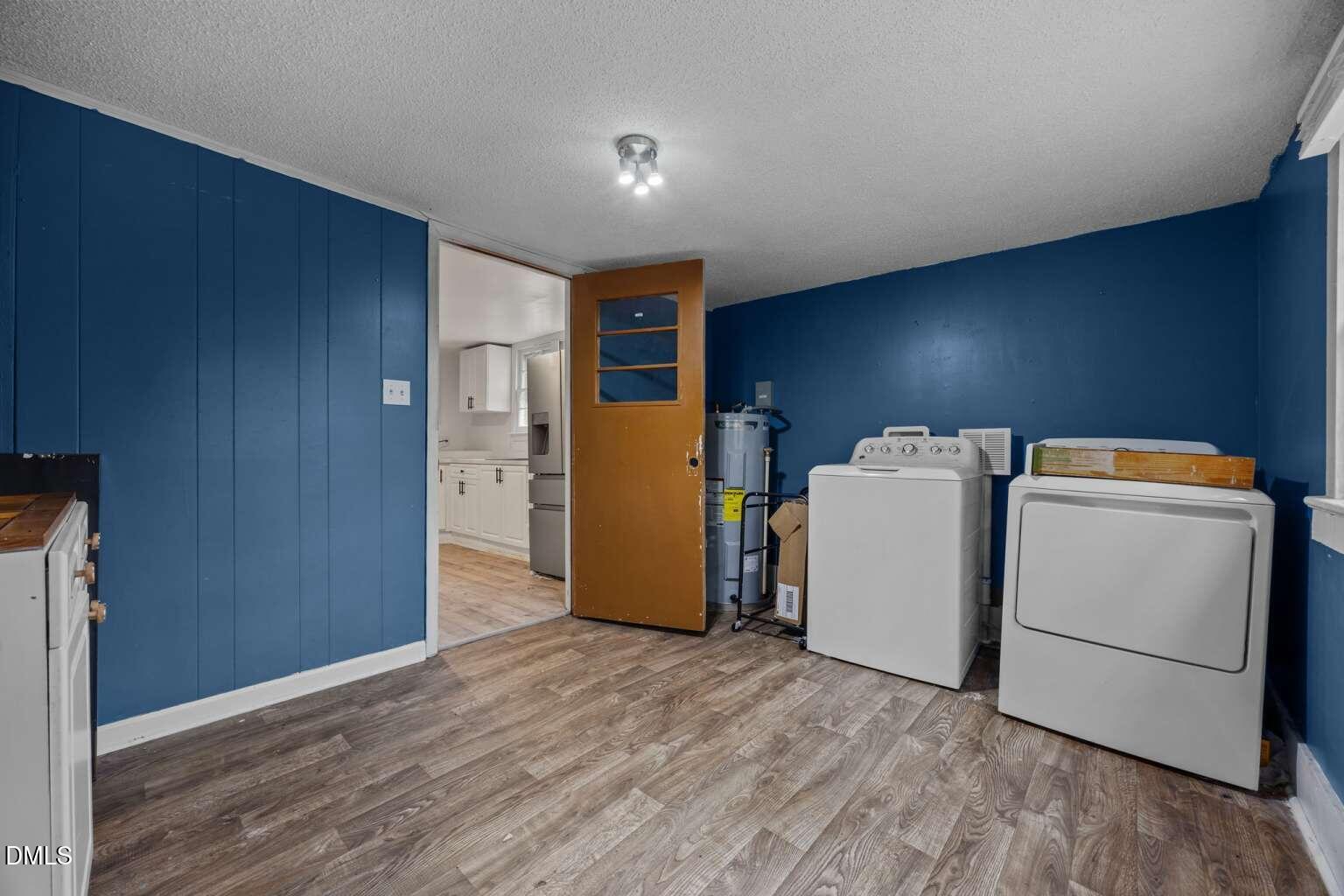 2821 Old Fairground Road Angier, NC 27501 - Photo 10 of 32 a view of a storage & utility room with a refrigerator