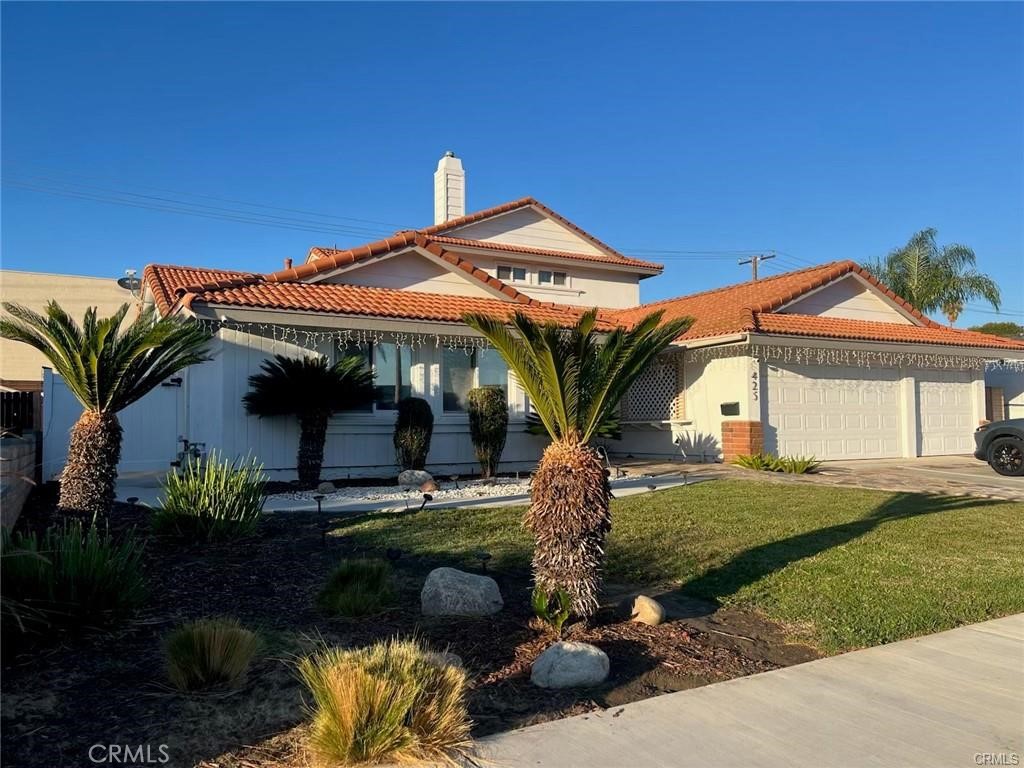 425 Lewis Place Placentia, CA 92870 - Photo 3 of 15 a front view of a house with garden