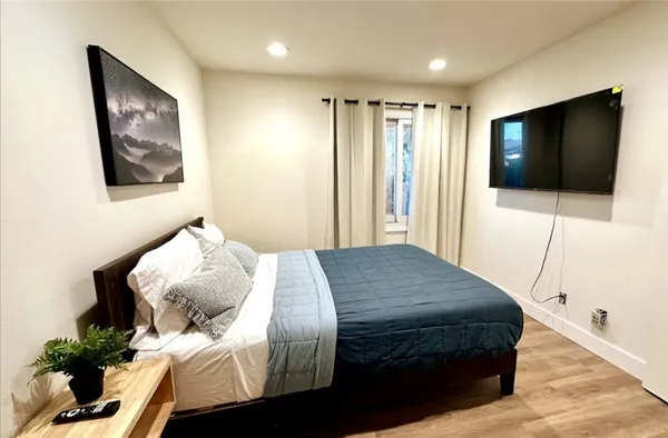 a bedroom with bed and a window