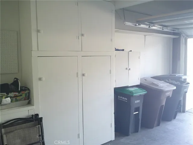 a room with cabinets and a table