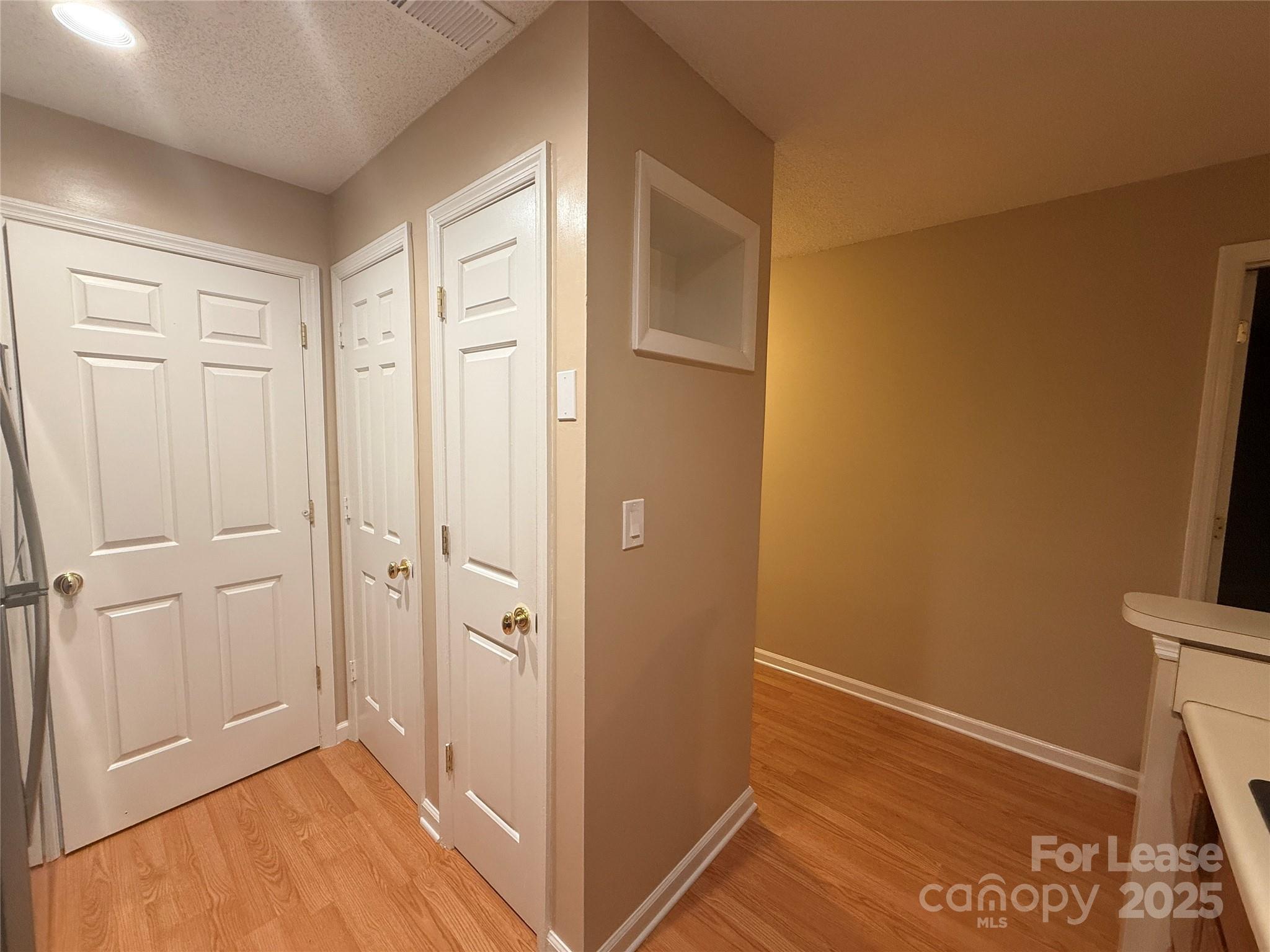 18801 Nautical Drive, Unit 203 Cornelius, NC 28031 - Photo 13 of 28 a view of a hallway with wooden floor