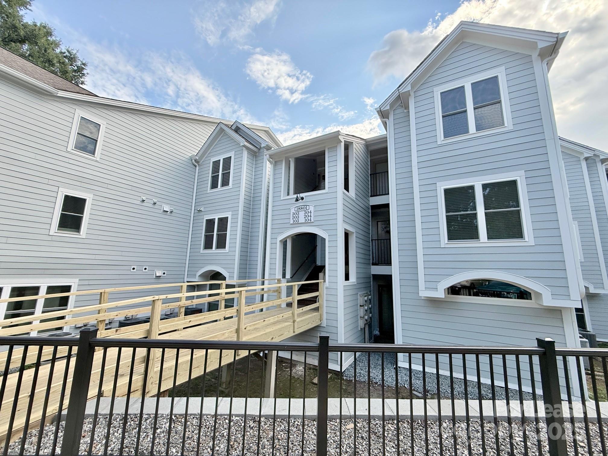 18801 Nautical Drive, Unit 203 Cornelius, NC 28031 - Photo 2 of 28 a front view of a house with balcony
