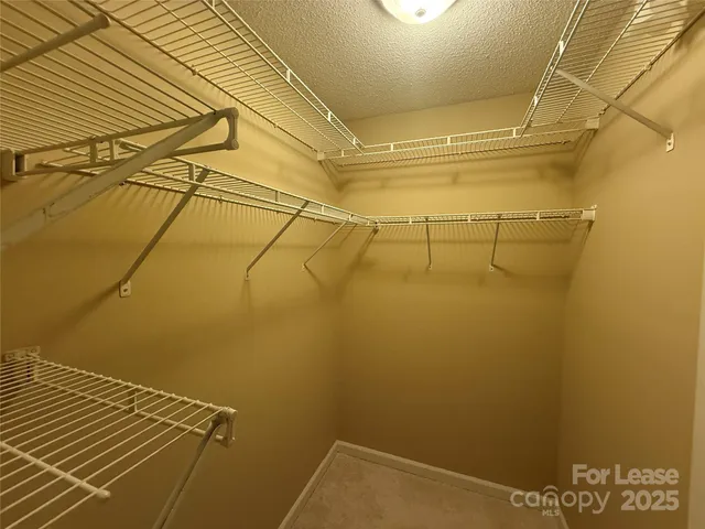 a bathroom with a sink mirror toilet and shower