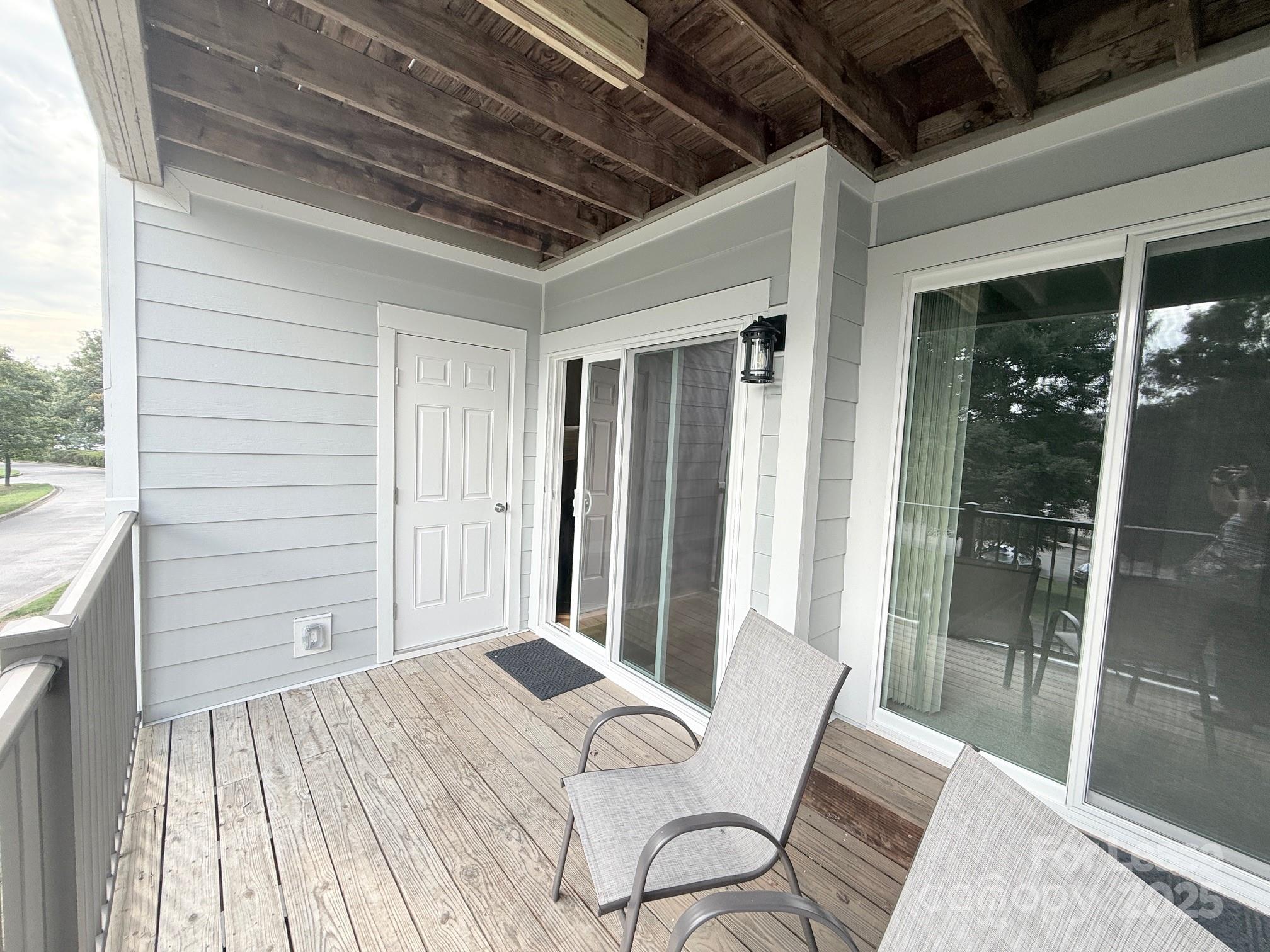 18801 Nautical Drive, Unit 203 Cornelius, NC 28031 - Photo 24 of 28 a bedroom with a bed and a window
