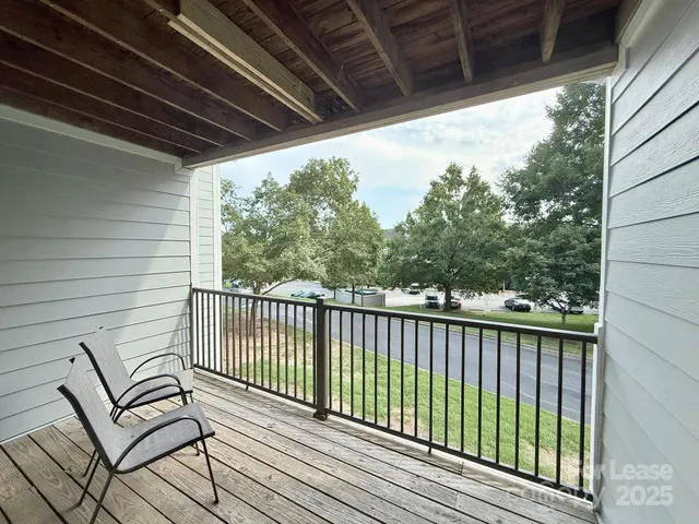 a view of a yard with trees