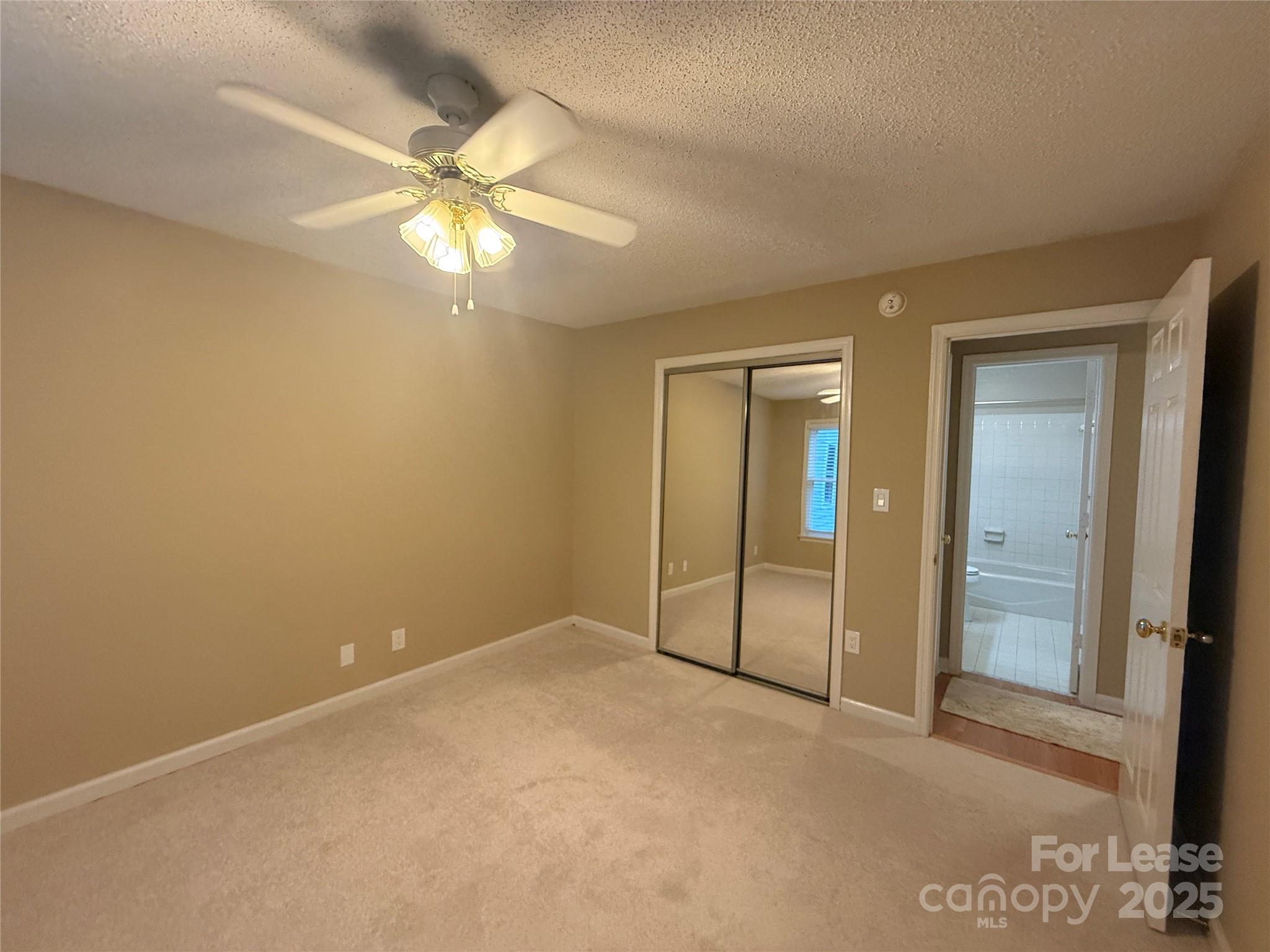 18801 Nautical Drive, Unit 203 Cornelius, NC 28031 - Photo 5 of 28 a view of an empty room with a fan