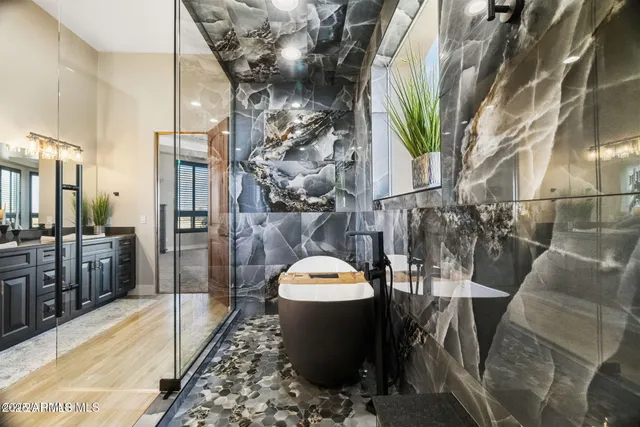 a bathroom with double vanity sinks and a granite