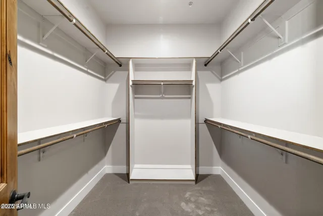 a view of an empty room with a balcony