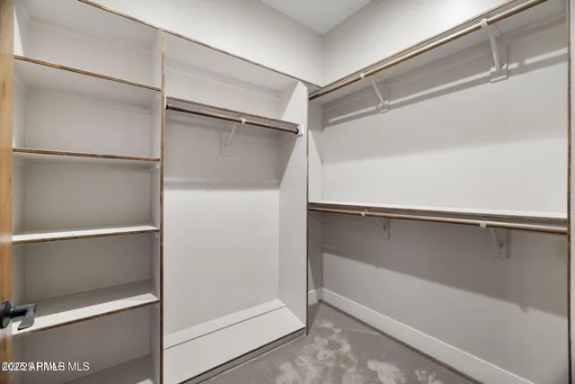 an aerial view of a house with a swimming pool and sitting area