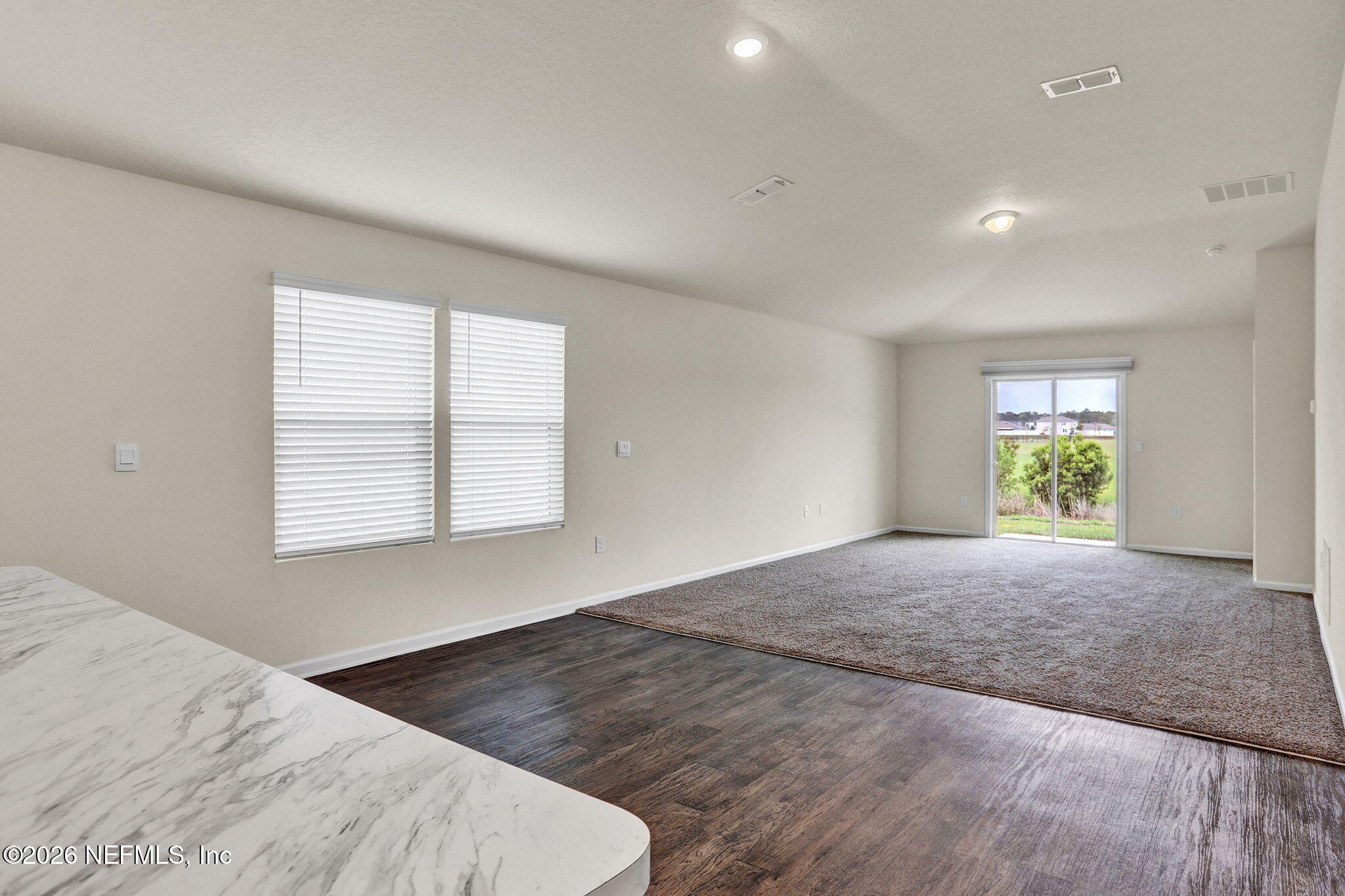 339 Caminha Rd Street St. Augustine, FL 32084 - Photo 13 of 43 Well Lit Living room and Kitchen