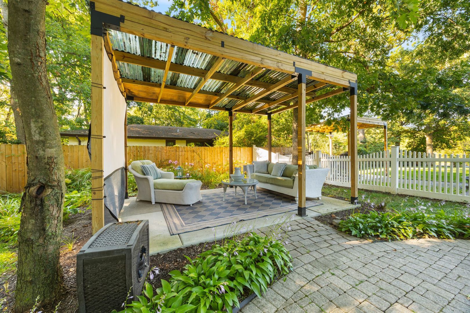 27W773 Beecher Avenue Winfield, IL 60190 - Photo 3 of 7 a view of a patio with table and chairs potted plants with wooden floor