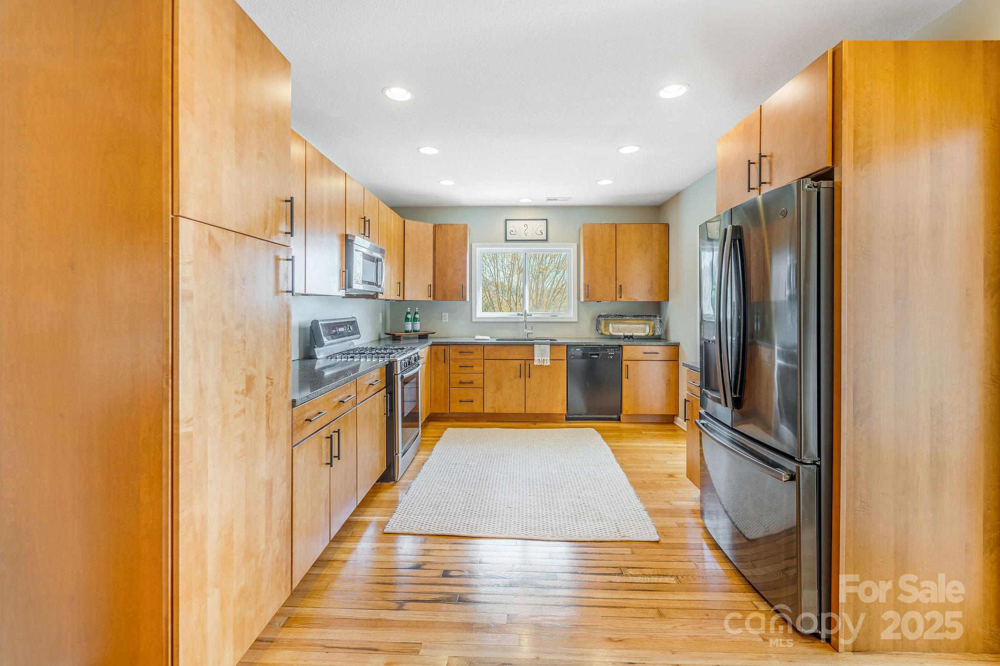 19 Westview Road Asheville, NC 28804 - Photo 14 of 44 a kitchen with stainless steel appliances granite countertop a refrigerator and a stove