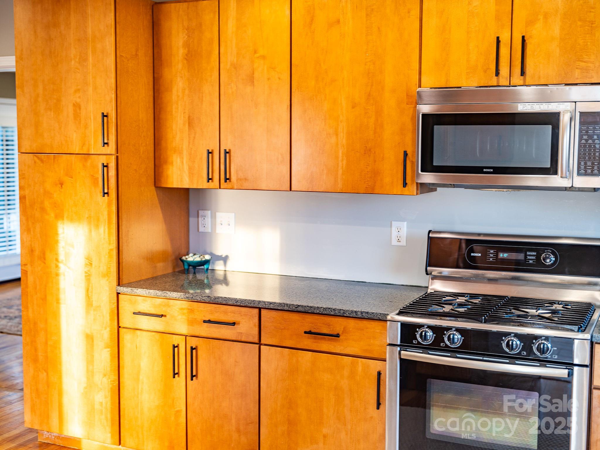 19 Westview Road Asheville, NC 28804 - Photo 15 of 44 a kitchen with a stove and a microwave