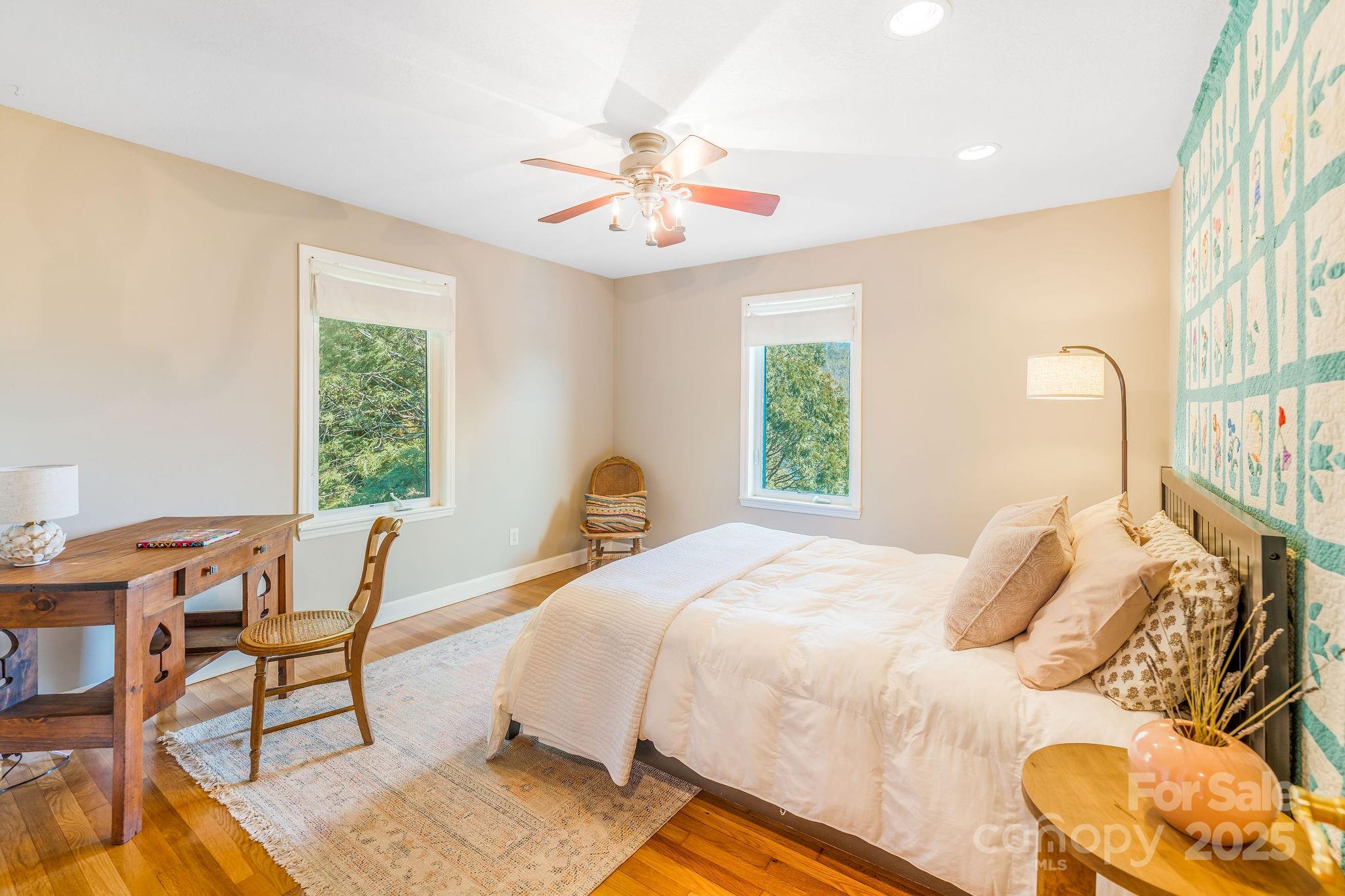 19 Westview Road Asheville, NC 28804 - Photo 23 of 44 a bedroom with a bed and a window