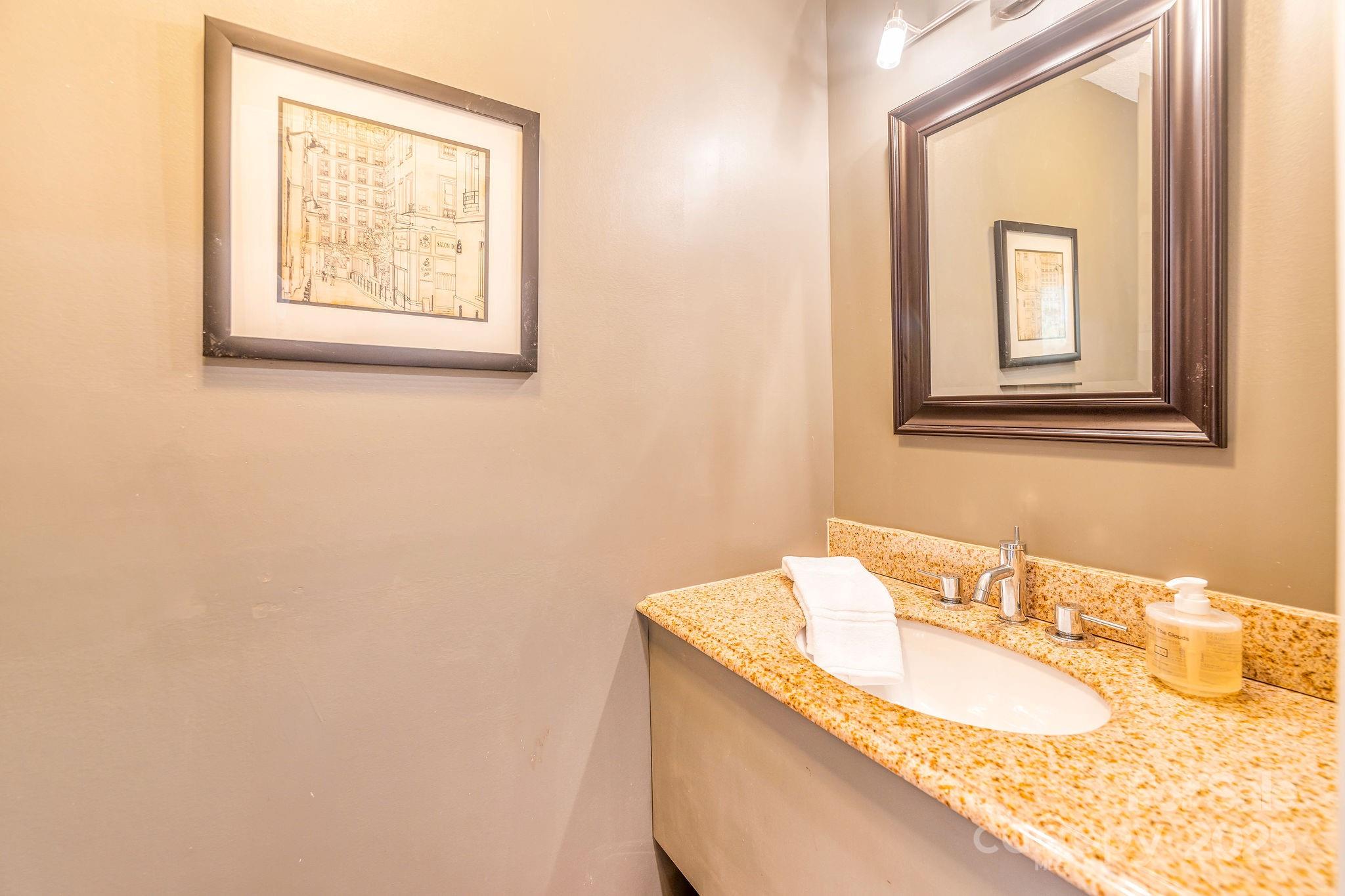 19 Westview Road Asheville, NC 28804 - Photo 26 of 44 a bathroom with a granite countertop sink and a mirror