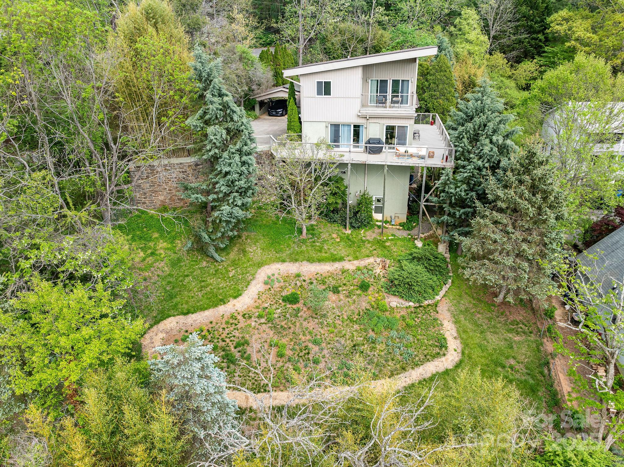 19 Westview Road Asheville, NC 28804 - Photo 3 of 44 a aerial view of a house with a yard and plants