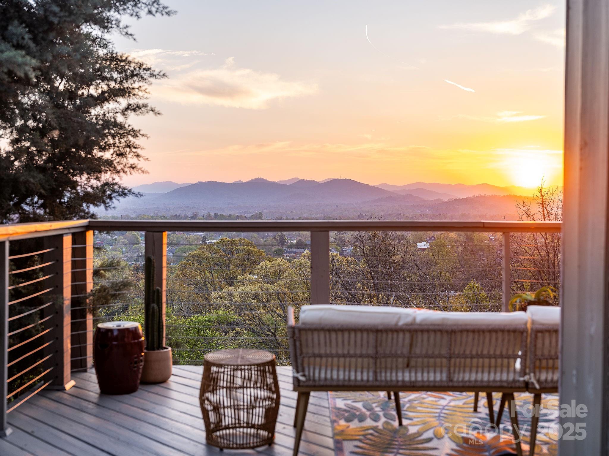 19 Westview Road Asheville, NC 28804 - Photo 41 of 44 a view of a chairs and table on the deck