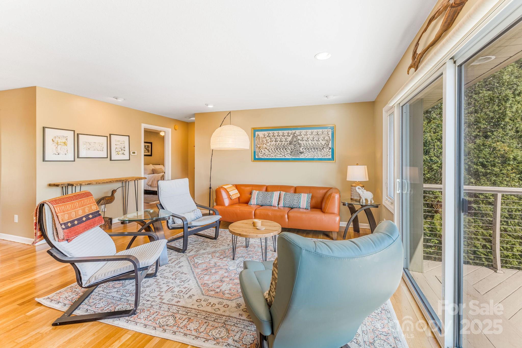 19 Westview Road Asheville, NC 28804 - Photo 8 of 44 a living room with furniture and a floor to ceiling window