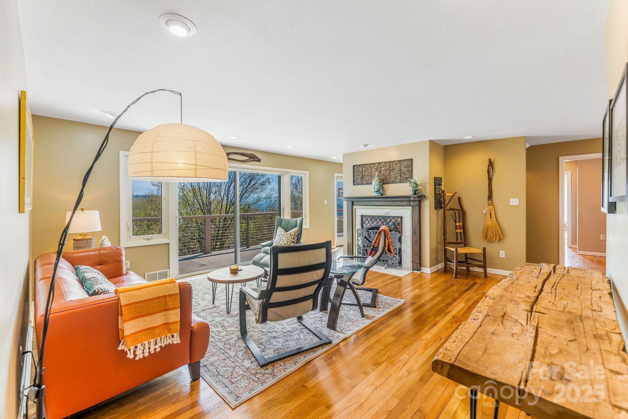 19 Westview Road Asheville, NC 28804 - Photo 10 of 44 a bedroom with furniture and a fireplace
