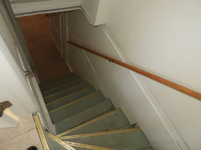 a view of a storage & utility room with two washing machine