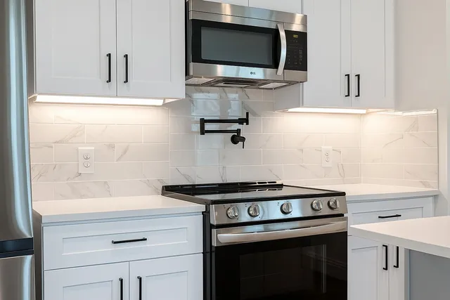 a kitchen with a stove and a microwave