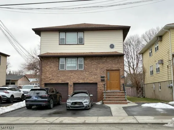 a car parked in front of a house