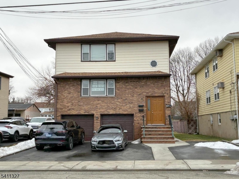 388 Garibaldi Avenue Lodi, NJ 07644 - Photo 1 of 20 a car parked in front of a house