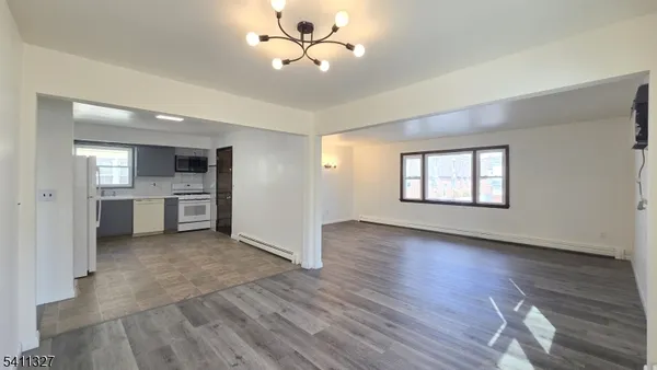 a view of a kitchen with a sink and a window