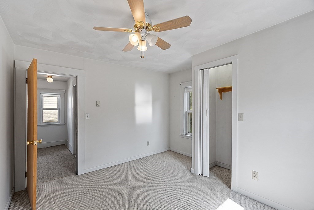 202 Beaconsfield Road Worcester, MA 01602 - Photo 19 of 38 an empty room with fan and entrance