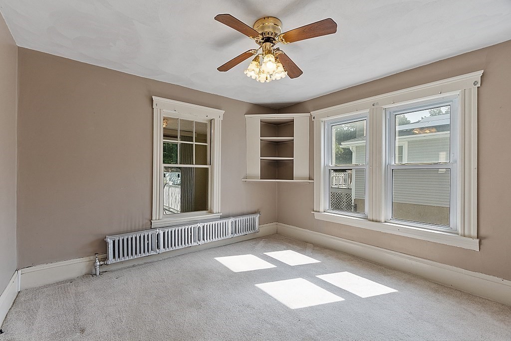 202 Beaconsfield Road Worcester, MA 01602 - Photo 23 of 38 an empty room with a window and ceiling fan