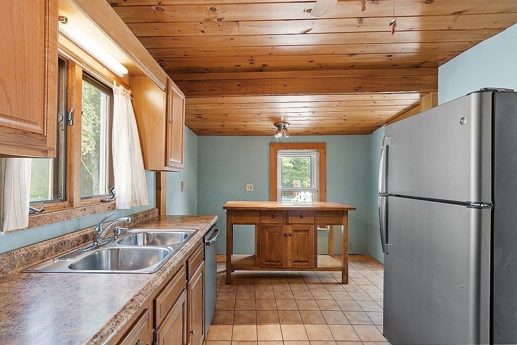 202 Beaconsfield Road Worcester, MA 01602 - Photo 27 of 38 a kitchen with a refrigerator and a sink