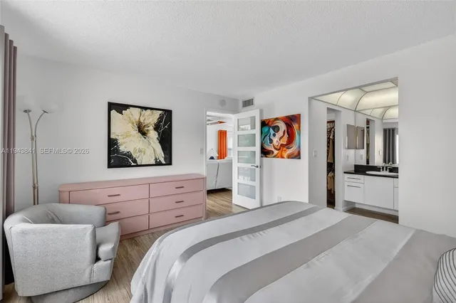 a bedroom with a bed and a couch