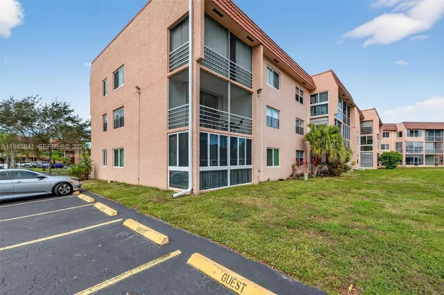 a view of a building with a yard