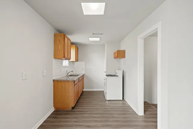 a view of a kitchen from the hallway
