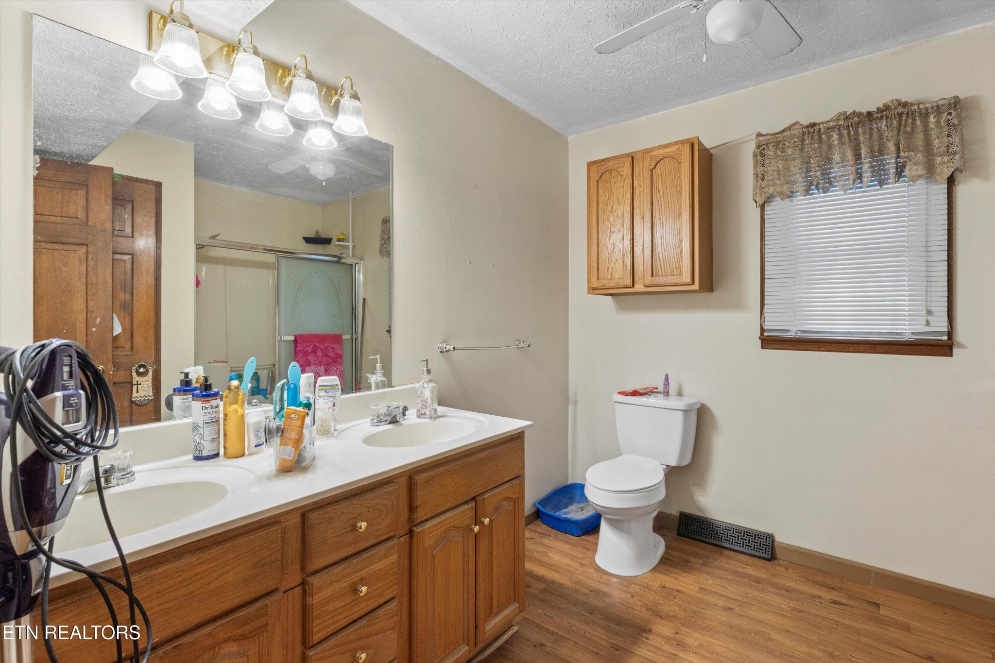 226 Thacker Drive La Follette, TN 37766 - Photo 15 of 51 a bathroom with a sink mirror and toilet