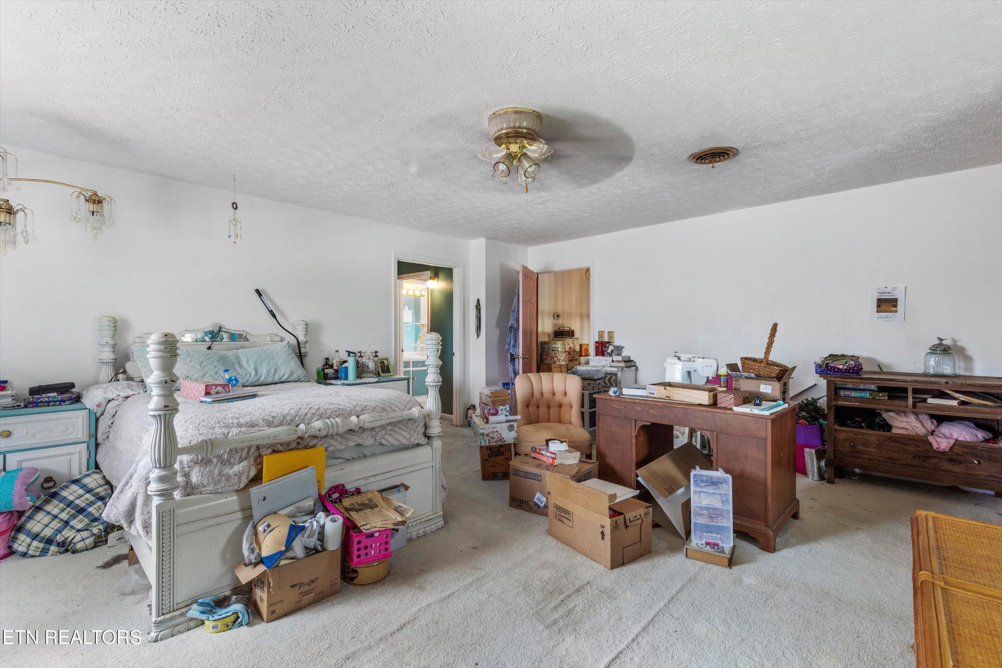 226 Thacker Drive La Follette, TN 37766 - Photo 22 of 51 a bed room with furniture and a chandelier
