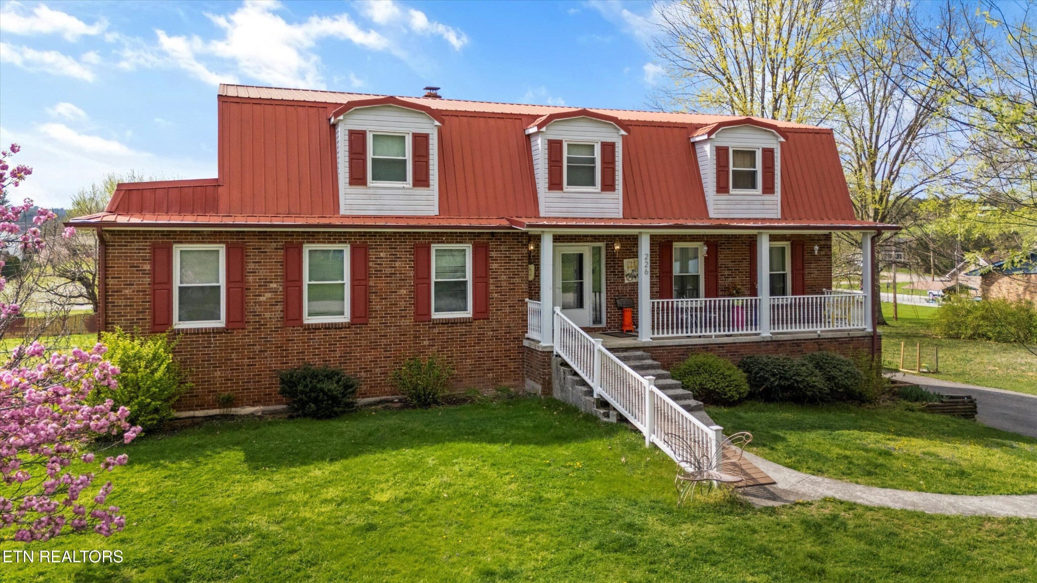 226 Thacker Drive La Follette, TN 37766 - Photo 3 of 51 a front view of a house with a yard