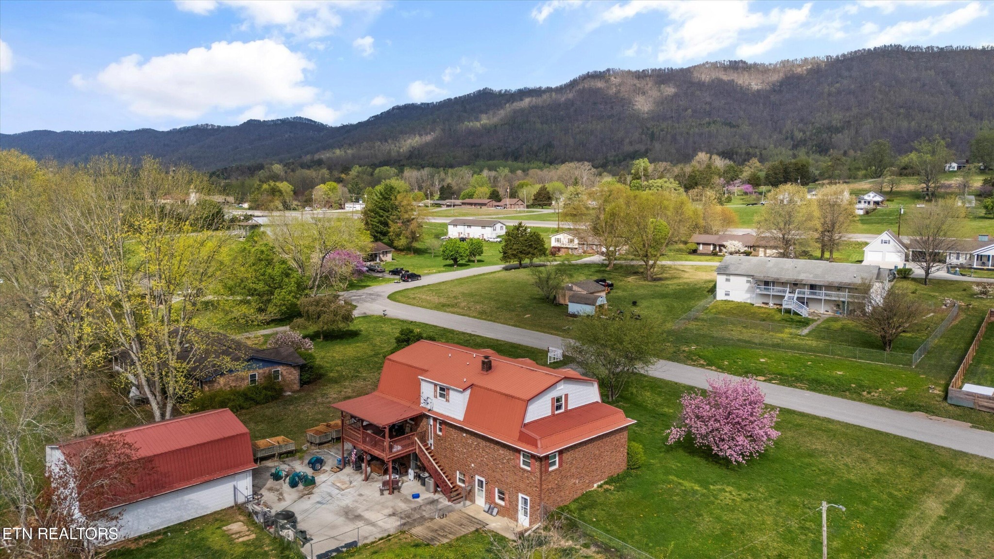 226 Thacker Drive La Follette, TN 37766 - Photo 42 of 51 a view of a lake with couches in front of house