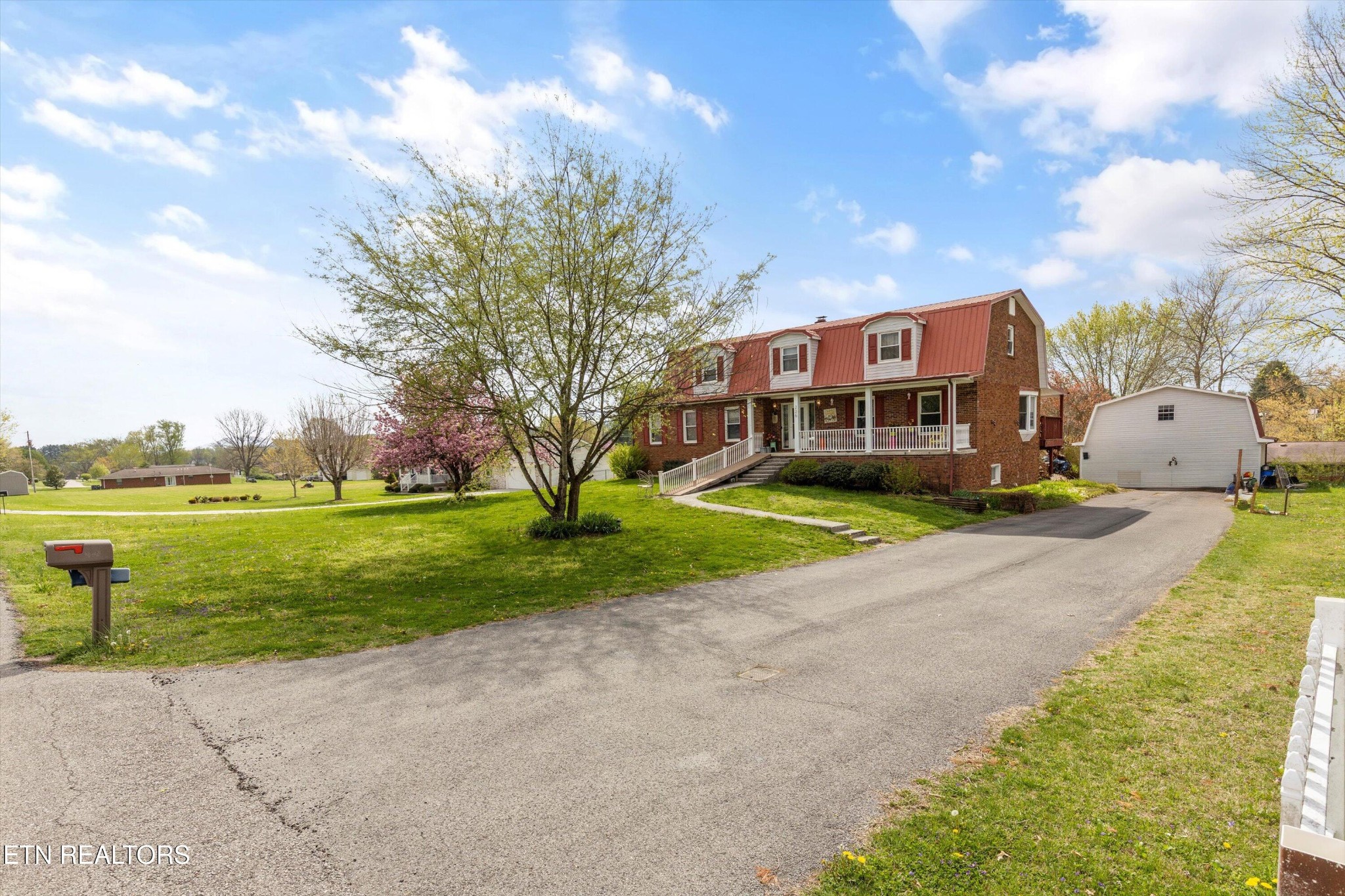 226 Thacker Drive La Follette, TN 37766 - Photo 5 of 51 a front view of a house with a yard