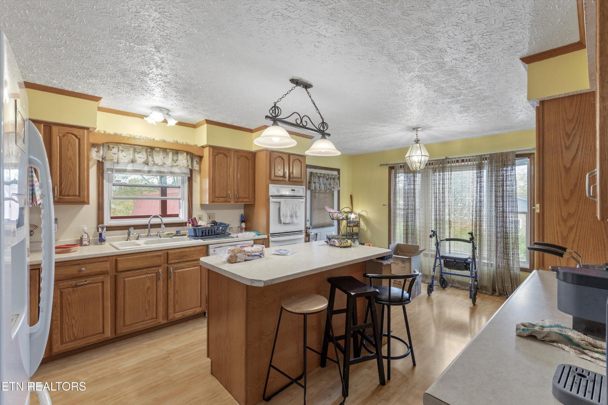 226 Thacker Drive La Follette, TN 37766 - Photo 10 of 51 a large kitchen with a table and chairs