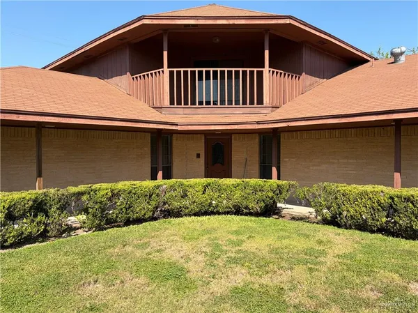 a front view of a house with yard