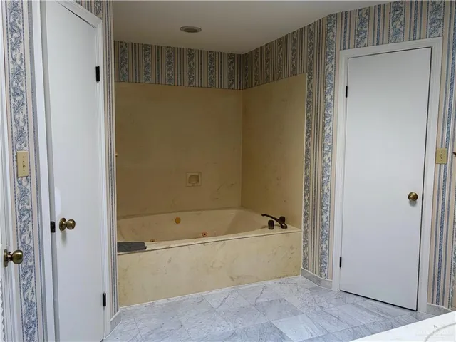 an empty room with a bench