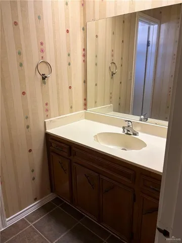 an empty room with wooden floor and closet